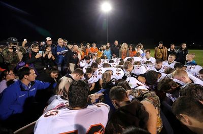 ‘If he wins, they’ll implement a Christian version of sharia law’: The community divided by prayers of high school football coach