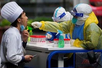 Shanghai hunkers down for final COVID battle, Beijing outbreak stubborn