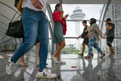 Singaporeans dash for passports as borders reopen