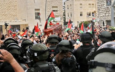 Outcry after Israel police beat mourners at journalist funeral