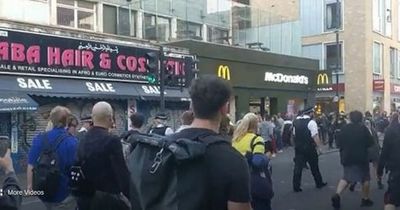 Police 'chased' down street during 'violent' protest and called 'scum'