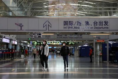 China tightens curbs on overseas travel as part of Covid battle