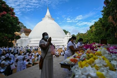 Crisis-hit Sri Lanka lifts curfew for Buddhist festival