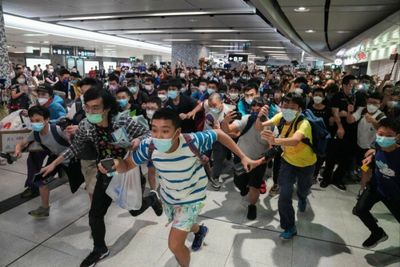 Hong Kong railway fans queue overnight to try new cross-harbour train