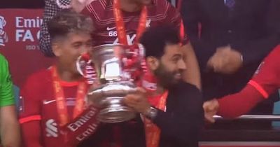 Mohamed Salah spotted on camera preventing Kostas Tsimikas from lifting FA Cup in prank