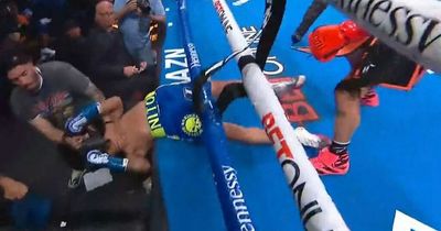 Boxer sent crashing through the ropes and out of ring in brutal knockout