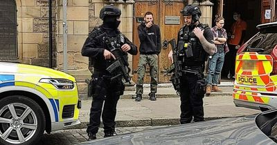 Edinburgh armed officers pictured outside theatre by concerned resident