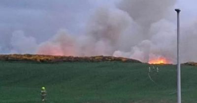 Fire crews work overnight to battle huge wildfire ripping through Scots hills