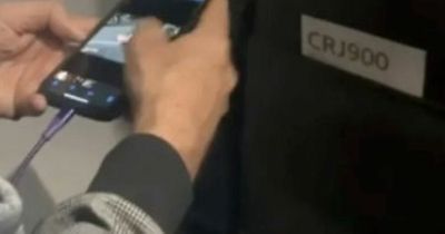 Woman appalled as she catches man secretly taking pictures of her feet on flight