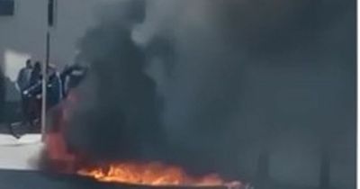 WATCH: Car bursts into flames and goes up in thick black smoke on busy Dublin Street