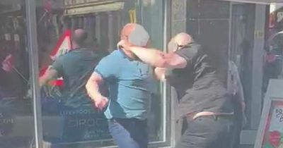 Men outside Slug and Lettuce punch each other in the head seconds after hugging