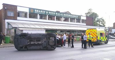 Emergency services called as car flips next to Hyson Green supermarket