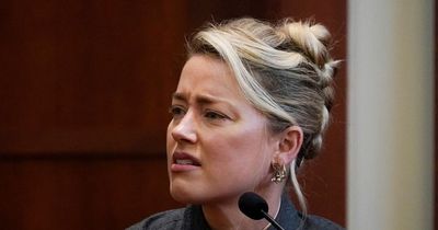 Amber Heard claims Johnny Depp 'threw phone at her after row over poo in bed'