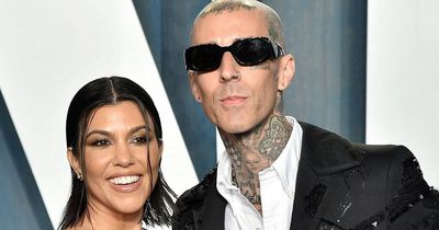 Kourtney Kardashian wedding pictures - star straddles Travis Barker on vintage Cadillac