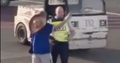 Rangers fan booted off Ryanair flight before heated spat with cop on tarmac as six fans ejected