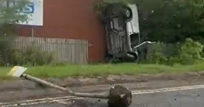 Transit van flips onto front and crashes into wall outside hospital