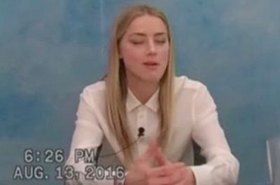 Amber Heard smiles in 2016 deposition when asked about audio of her admitting to striking Johnny Depp