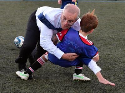 Morrison bowls over child playing soccer
