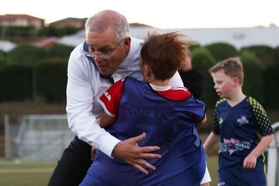 ‘Please tell me he hasn’t gone to hospital’: Morrison the bulldozer knocks over a child while playing football