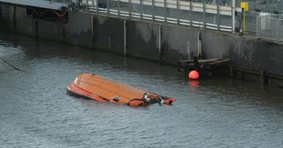 Boat capsized in crash with Ferry terminal on River Mersey