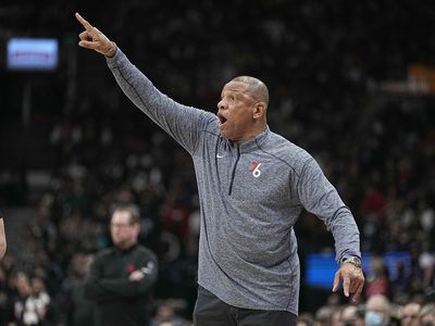 A 76ers fan held up a ‘Fire Doc Rivers’ sign at his graduation and it might be the most Sixers thing ever