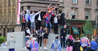 Rangers fans flock to Glasgow's George Square and pubs as cops on high alert