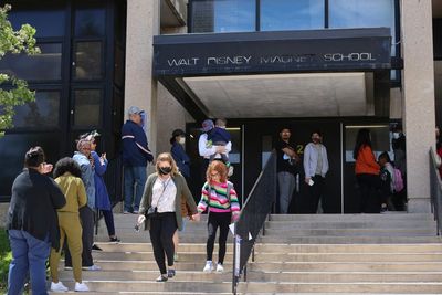 Gun in 8-year-old's backpack goes off at school, mom charged