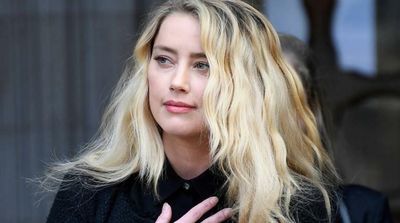 Johnny Depp Grabbed Amber Heard by Hair, Hit Her Repeatedly, Sister Says