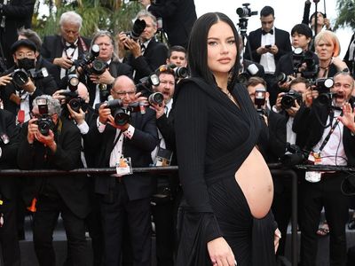 Adriana Lima channels Rihanna with bump-baring dress at Cannes