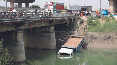 Lucknow: Close shave for driver as truck falls into canal
