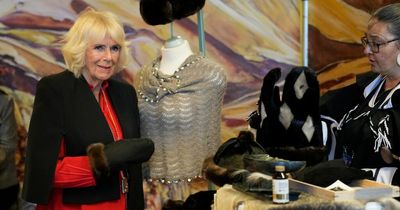 Camilla laughs after being given a stress ball made from beaver fur