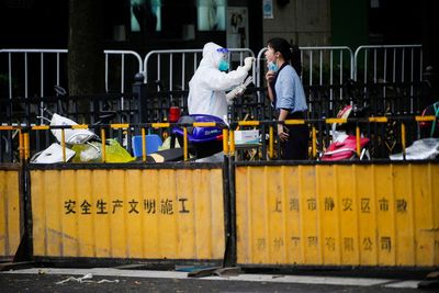 Locked-down Shanghai finds new cases, breaking "zero COVID" streak