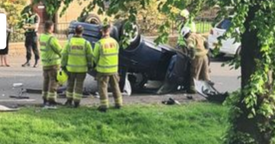 Man and toddler rushed to hospital after Falkirk crash leaves car flipped on roof