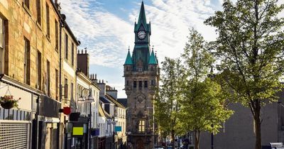 What defines a city and how is it decided as Dunfermline awarded new status