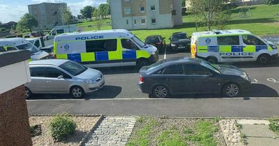 Police race to Kirkcaldy street after man 'hanging over' balcony following disturbance