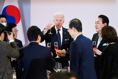 Biden signs $40bn Ukraine aid bill after it was flown to him in South Korea