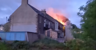 Man rushed to hospital after being rescued from burning building in Scots town
