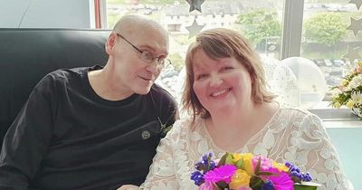 Emotional hospital wedding for 'smiling couple' as groom battles bowel cancer