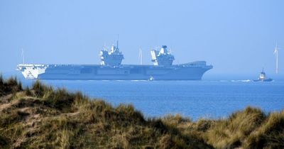 Royal Navy's biggest-ever warship that sends 'defiant message' spotted off British coast