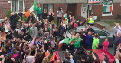 Amy Broadhurst sprays champagne as she returns home to Dundalk a hero in jubilant scenes