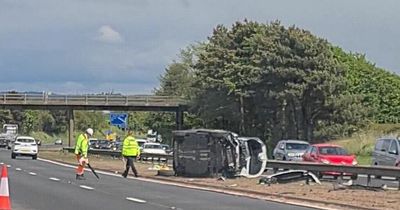 Devastating M8 images show aftermath of serious crash including pram in the debris