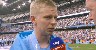 Oleksandr Zinchenko in tears as he drapes Ukrainian flag over Premier League trophy