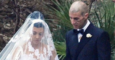 First picture of Kourtney Kardashian and Travis Barker as husband and wife