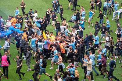 Football fans charged after pitch invasion at Manchester City vs Aston Villa
