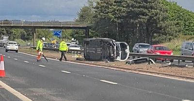 M8 crash aftermath sees 'pram and toys' littered in debris as two adults and child taken to hospital