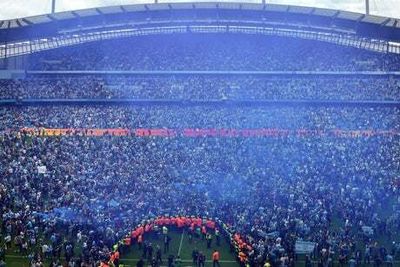 Two fans charged by police after pitch invasion that followed Man City’s dramatic Premier League title win