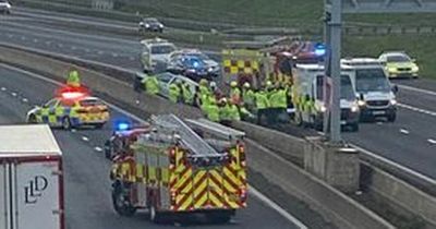 Car lands on M8 crash barrier near Eurocentral as two women rushed to hospital