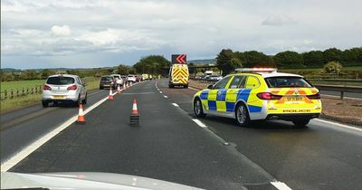 Child rushed to hospital after horror M8 crash which saw car flipped on side