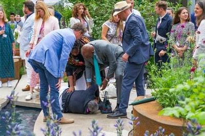 Ainsley Harriott helps rescue his sister after she falls into Chelsea Flower Show pond