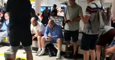 Manchester Airport passenger fed up with delays takes over Tannoy and belts out Sweet Caroline